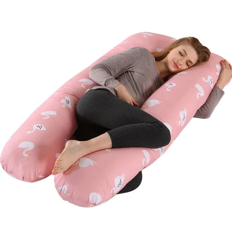 Large U-shaped pregnancy support pillow with removable cover and abdominal support belt.