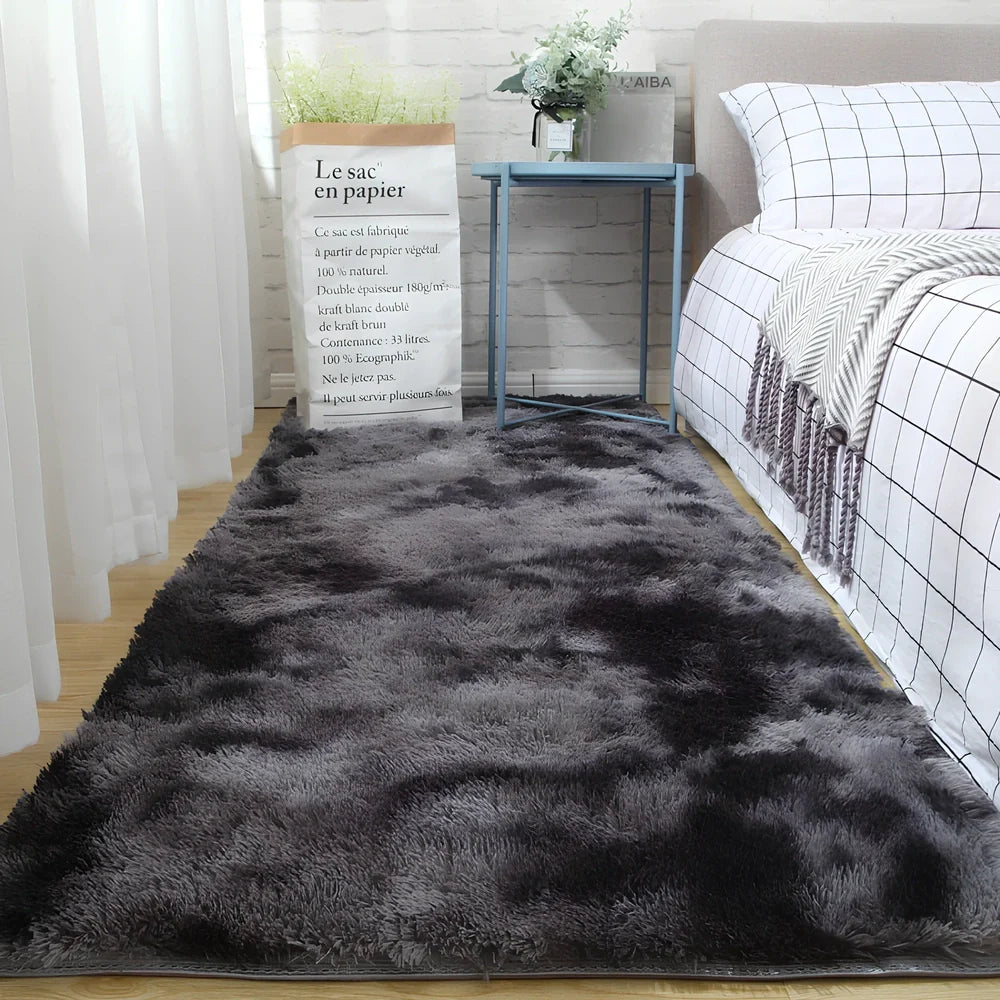 Tie-dyed variegated silk wool carpet floor mat showing organic colour patterns with polyester fibre suede backing