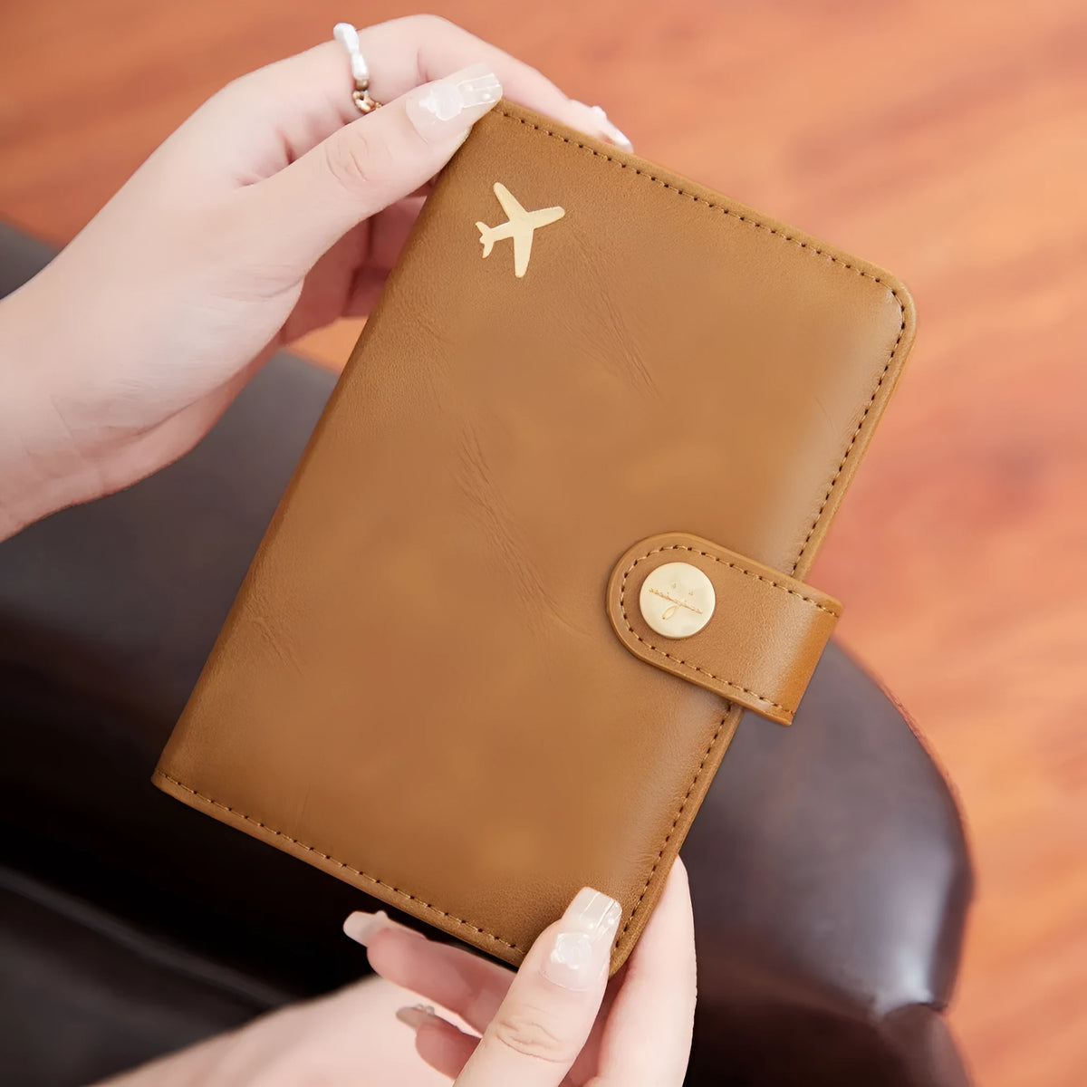 Simple PU leather passport holder in sapphire blue with visible sewing lines, showing card slots and RFID protection.