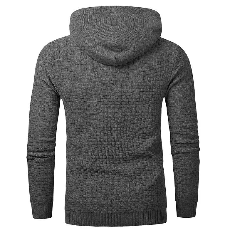 Man wearing a cotton-polyester blend hooded sweatshirt in grey, showing the front design and hood.