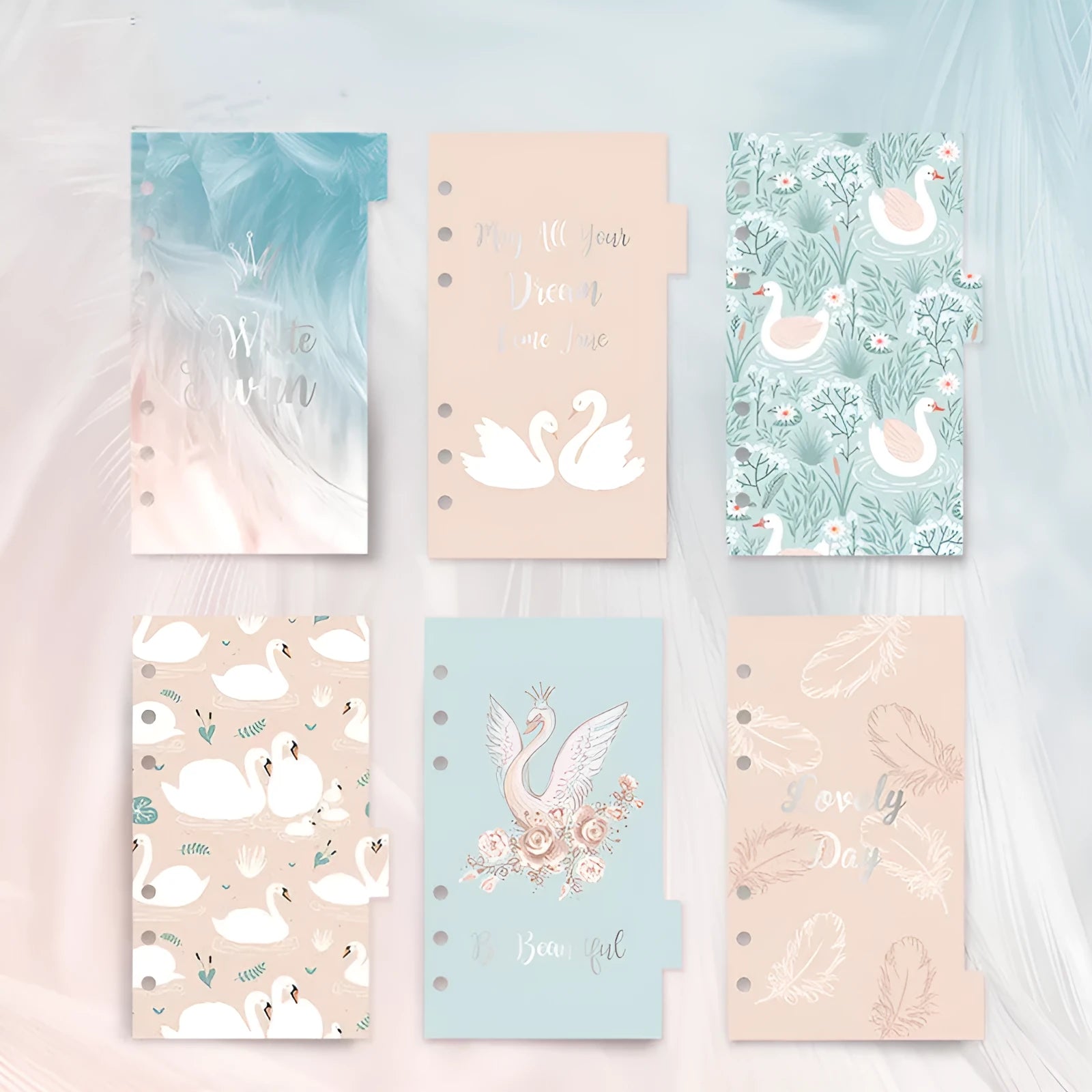 Set of six white A6 separator pages with colourful 'Swan handbook' design, showing front and back with index tabs.