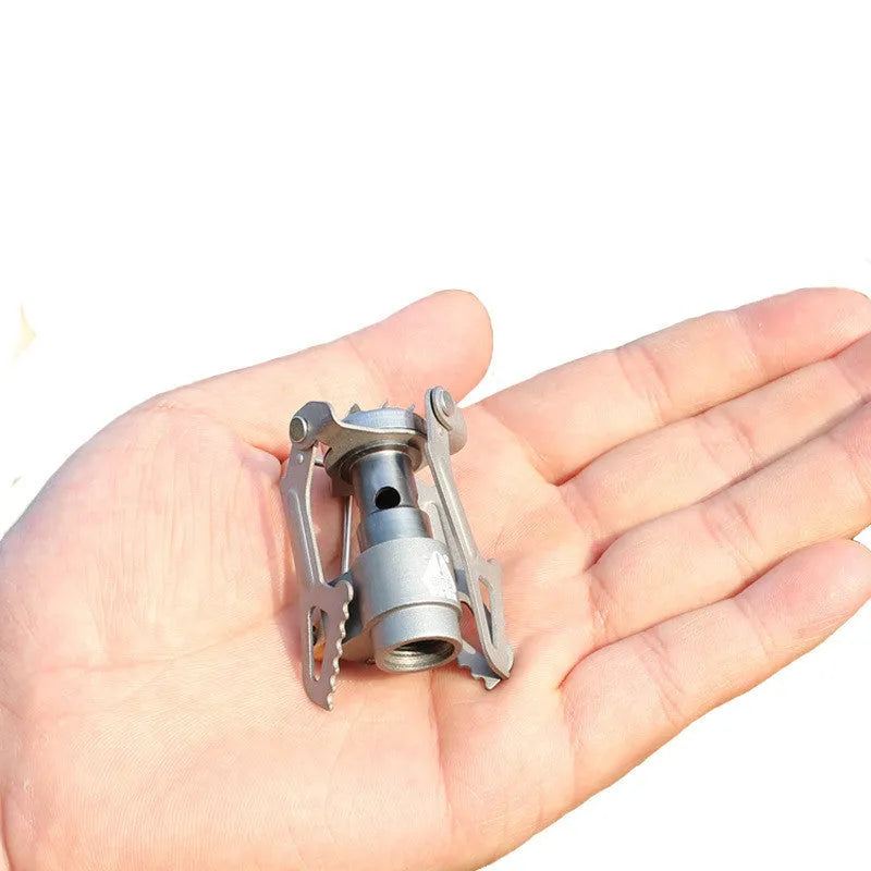 Portable camping stove with one-piece furnace structure, using propane fuel for outdoor cooking