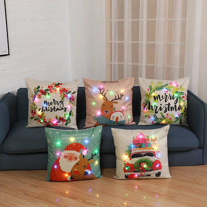 45cm square Christmas cushion with linen cover and battery-operated lighting showing festive design