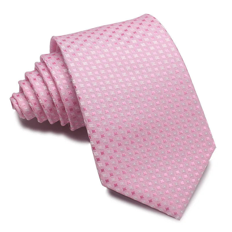 Close-up of a red and black striped jacquard weave tie with an arrow tip, showing texture.
