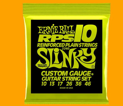 Coils of nickel-plated electric guitar strings and bass strings showing their metallic shine.