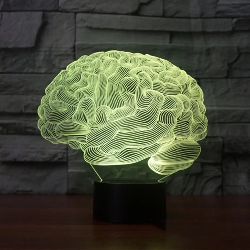 3D brain-shaped LED lamp with colour changing modes and remote control on wooden surface
