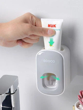 Wall-mounted automatic toothpaste dispenser with toothbrush holder and storage organizer, available in black and grey colors