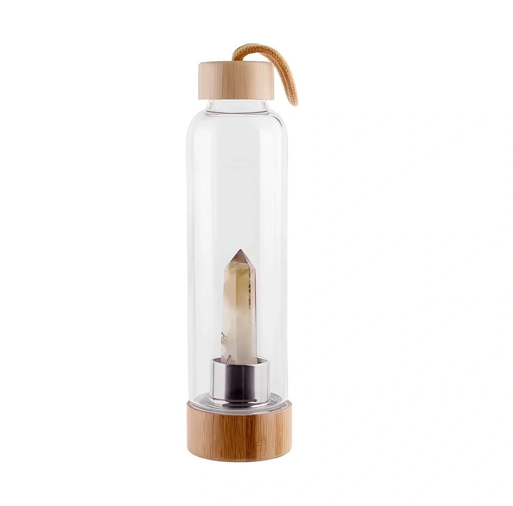 Crystal infused glass water bottle with bamboo lid showing mineral crystal inside 25cm tall container