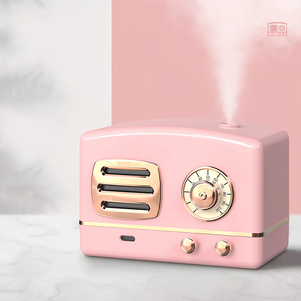 Green retro humidifier with bronzing finish measuring 9.5cm tall on wooden desk