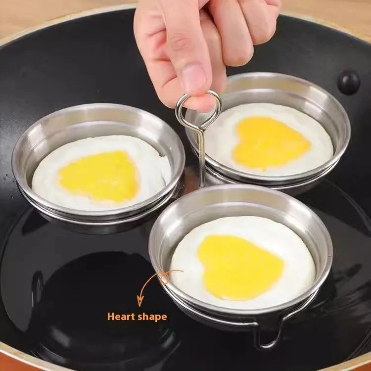Heart-shaped stainless steel egg steamer with compact 15cm dimensions and 1.5-litre cooking capacity