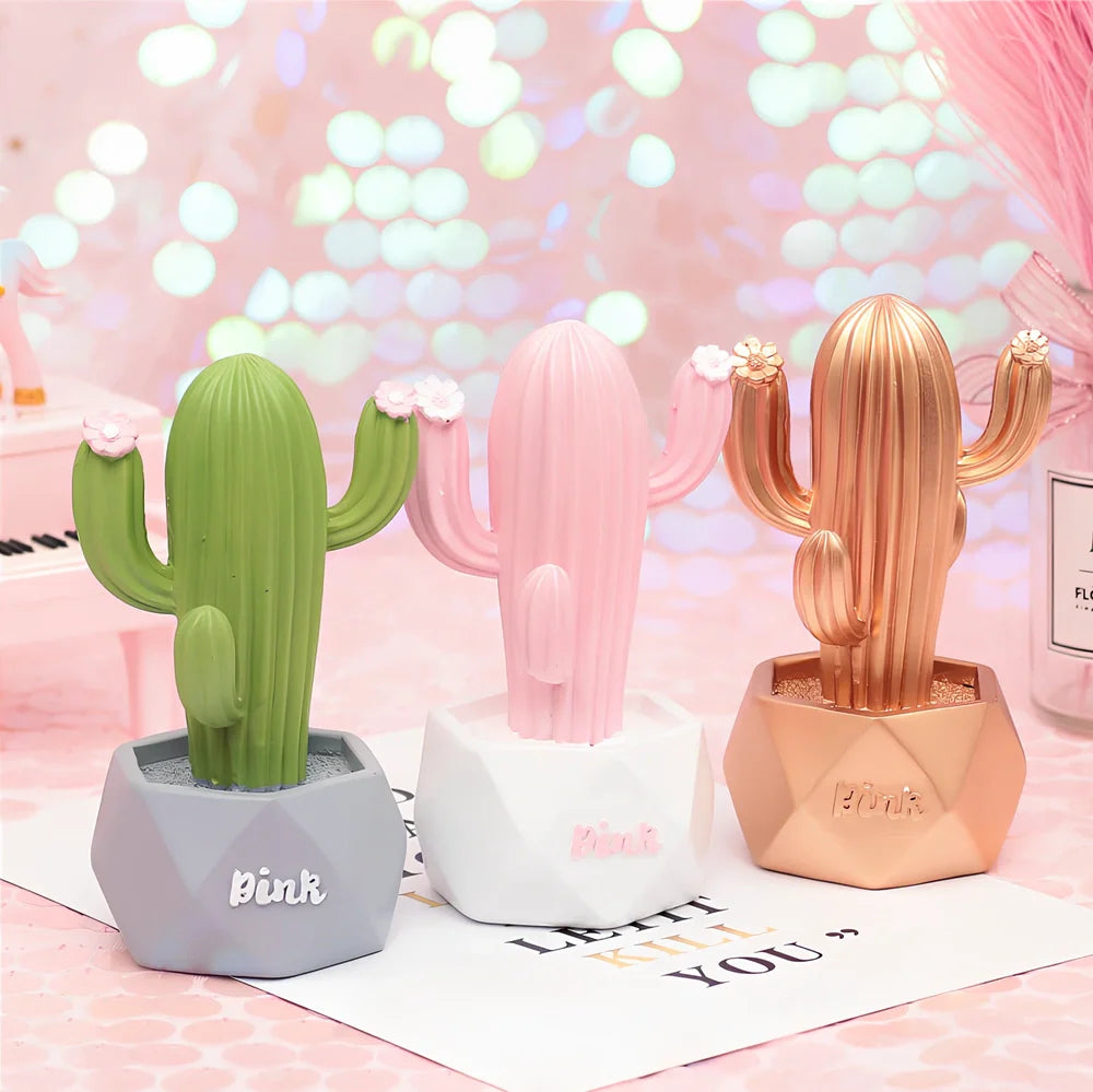 Cactus-shaped resin night light in gold finish measuring 15cm tall with warm LED glow