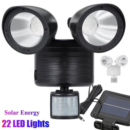 Black dual-head solar security spotlight with motion sensor for outdoor wall mounting