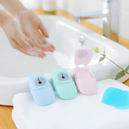 Pack of 50 pink biodegradable soap paper sheets, each 8x4.5cm, for portable hand cleaning on travels