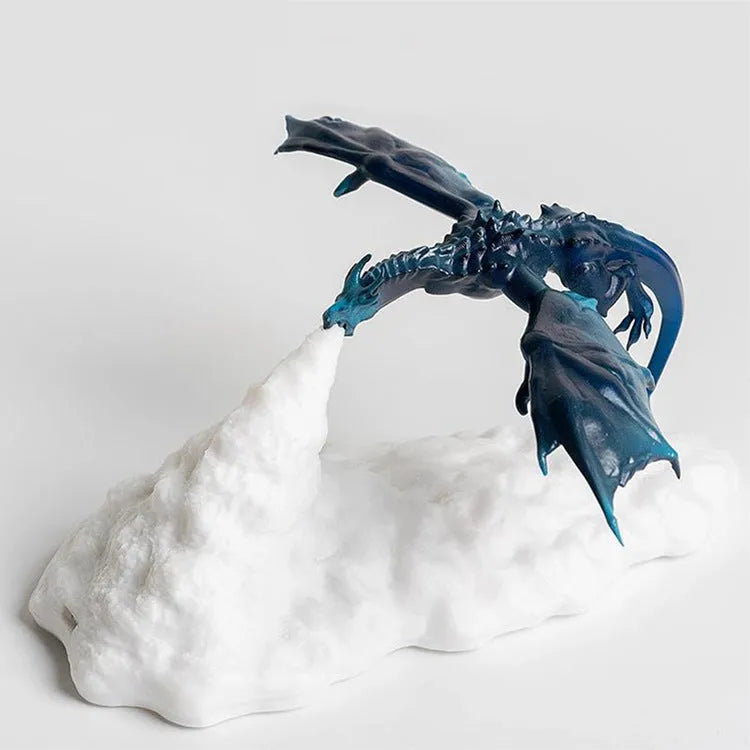 3D printed fire-breathing dragon night light with warm red LED illumination on dark surface