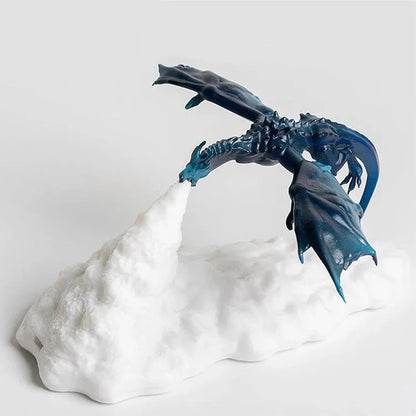 3D printed fire-breathing dragon night light with warm red LED illumination on dark surface