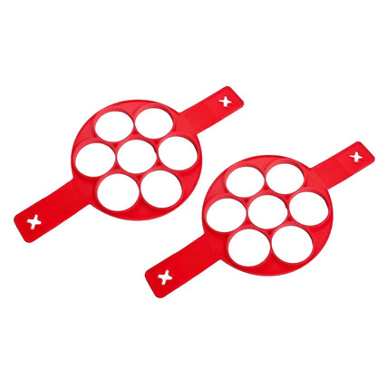 Red silicone egg mould measuring 3x3x6 inches for creating shaped hard-boiled eggs without shells