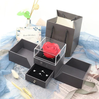Blue jewellery gift box with plastic eternal flower decoration for Valentine's Day accessories storage