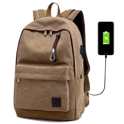 Coffee-coloured canvas backpack with USB charging port on side strap and front zipper pocket.