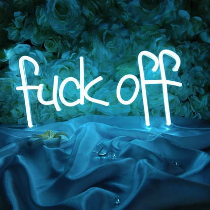 Stylish neon letter lights in various designs, including 'FUCK OFF', 'ON AIR', 'HAPPY', 'RELAX', 'HUSTLE', and 'HUSTE', illuminating a cozy living space.