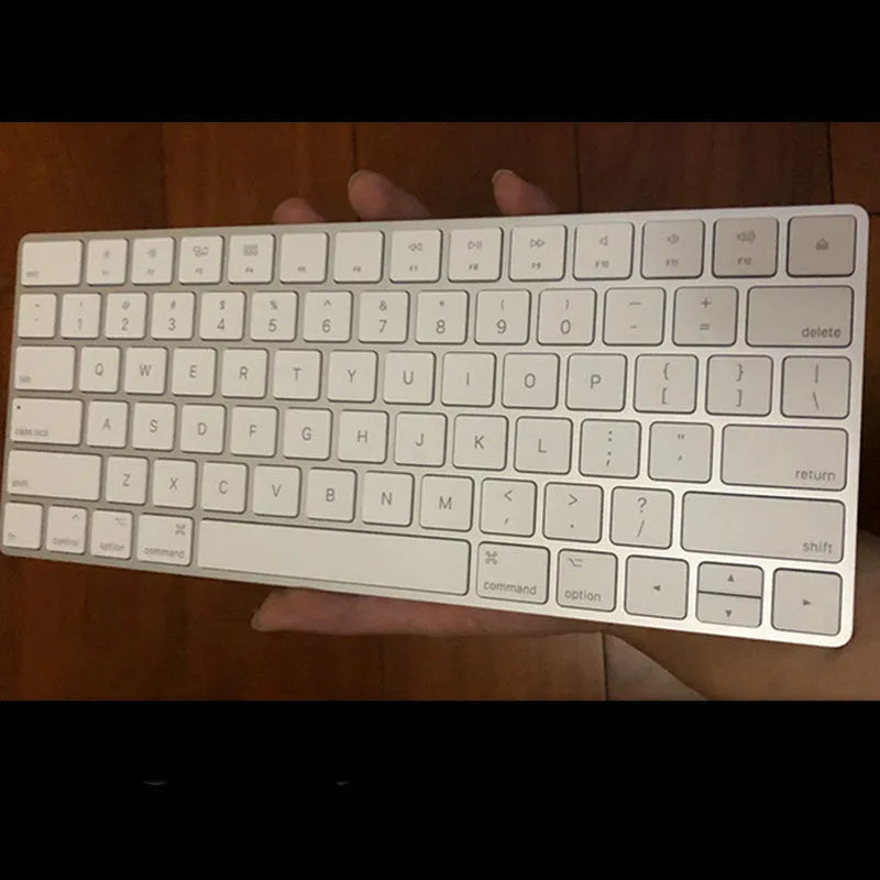White Apple G6 ultra-thin metal Bluetooth wireless keyboard on a desk