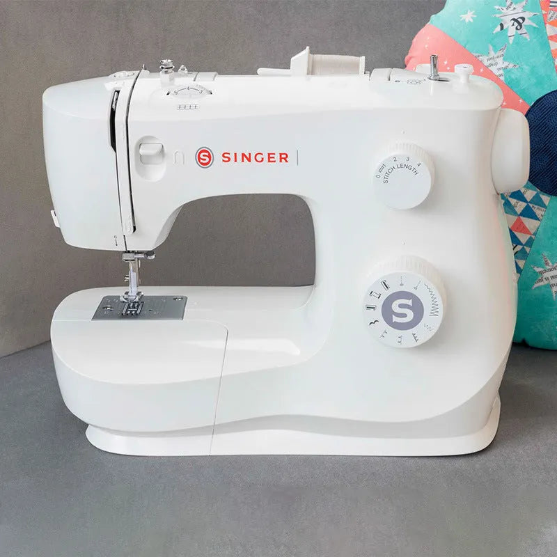 M2405 portable household sewing machine with accessories on table showing compact 47x39x26cm size