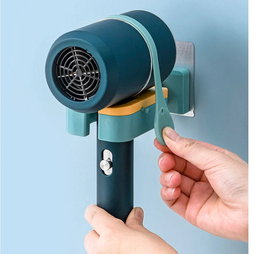 Adjustable wall-mounted hair dryer rack in orange, pink, and green