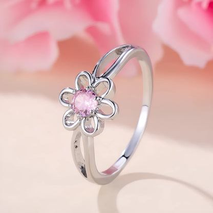 Women's hollow flower design fashion ring in electroplated copper with a platinum pink diamond finish.