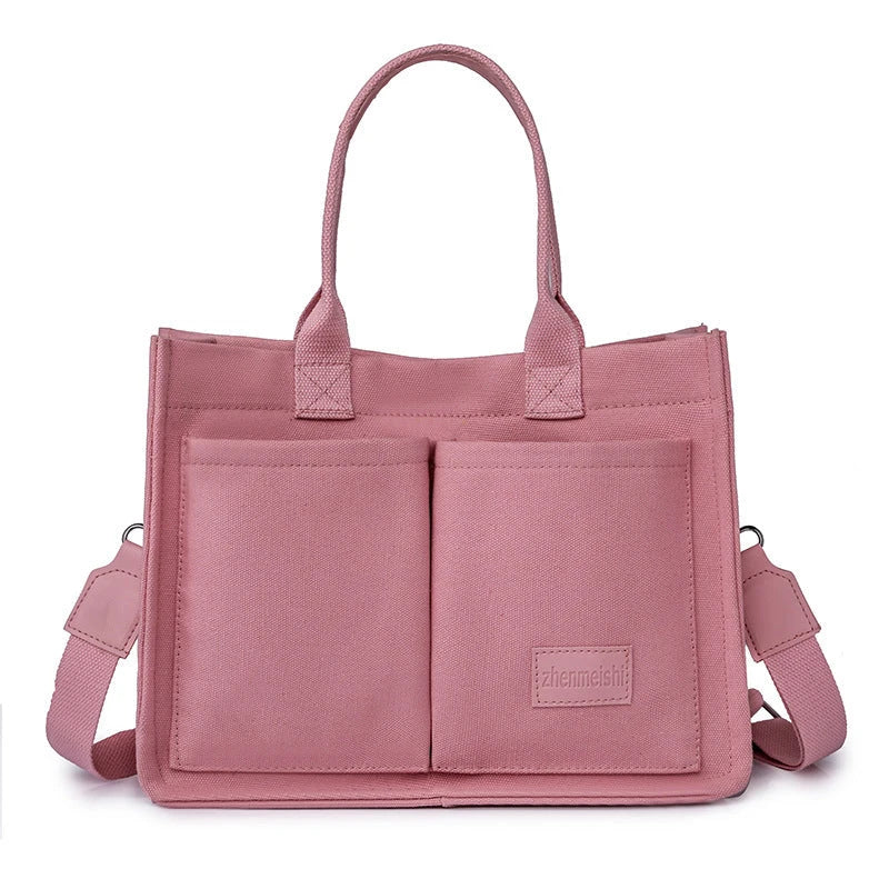 Premium canvas tote bag in multiple colors with adjustable shoulder strap and organizational pockets