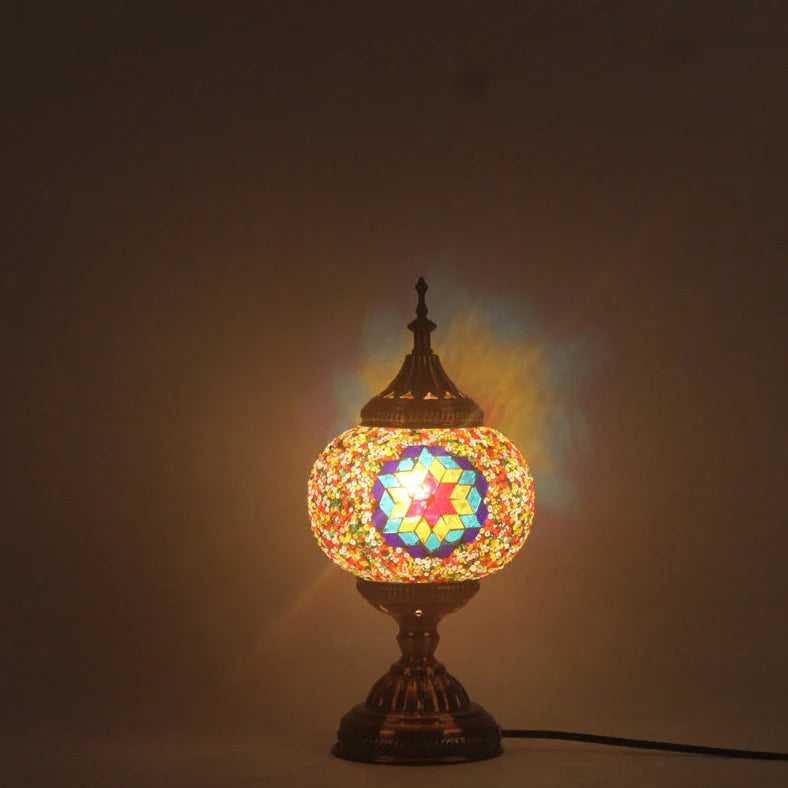 Glass table lamp with 150mm diameter shade and 330cm cord on wooden surface