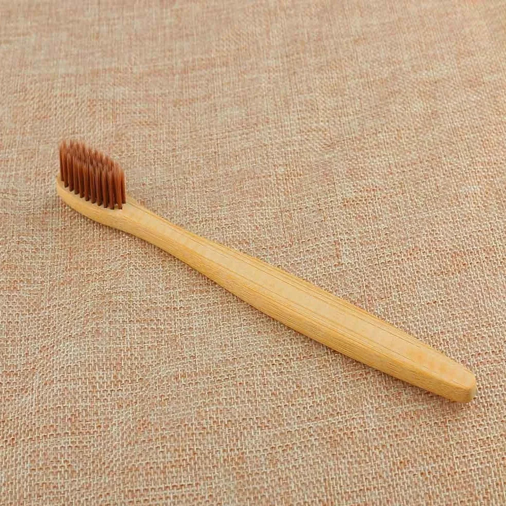Organic bamboo toothbrush with 17.5cm ergonomic handle and charcoal-infused bristles for sustainable dental care
