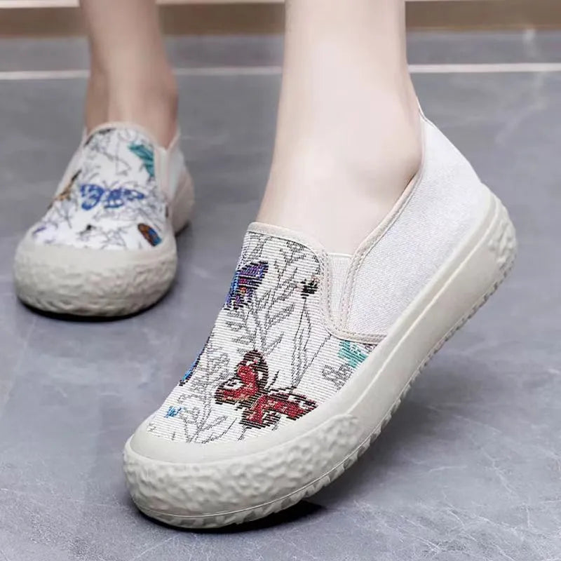 Women's classic canvas slip-on shoes with plastic soles in black and white colour options