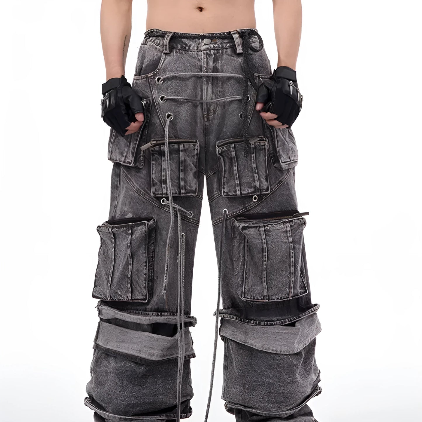 Grey distressed denim overalls with rope stitching on a man, showcasing the mop pant style.