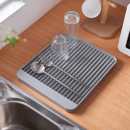 Sleek dish drainer tray made of high-quality ABS material with contemporary diatom mud drainage design, suitable for draining dishes and storing kitchen items