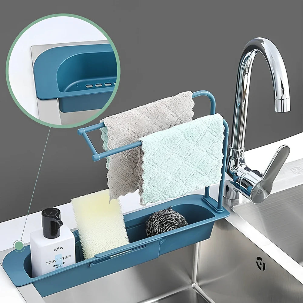 Blue telescopic sink rack holder with double-layer storage and drainage holes, mounted above kitchen sink