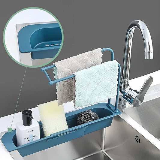 Blue telescopic sink rack holder with double-layer storage and drainage holes, mounted above kitchen sink