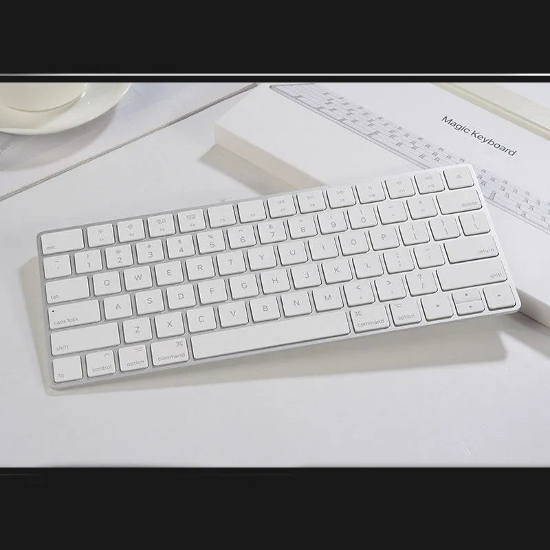 White Apple G6 ultra-thin metal Bluetooth wireless keyboard on a desk