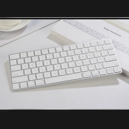 White Apple G6 ultra-thin metal Bluetooth wireless keyboard on a desk