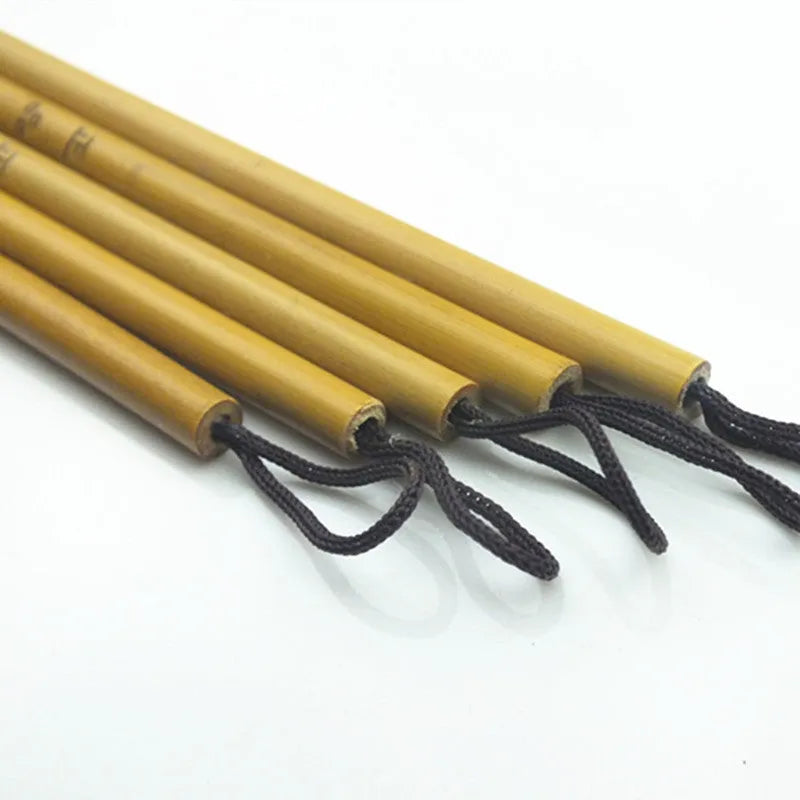 Red Chinese calligraphy brush with a 1.6cm long brush head and a 23cm wooden penholder.