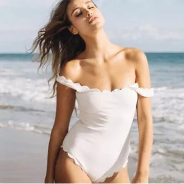 Black one-piece swimsuit with open back design, perfect for swimming and beach outings