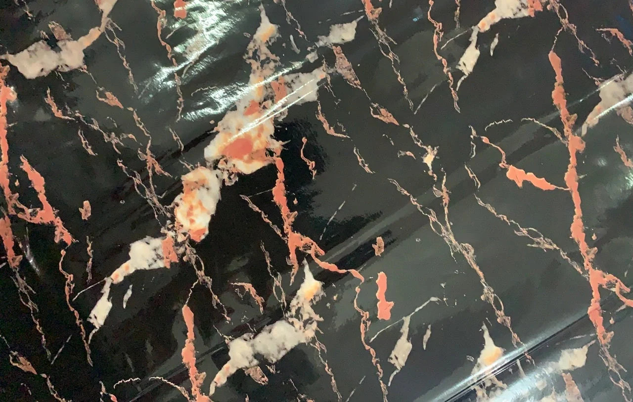 Premium peel-and-stick marble-look wall panels in various colors and sizes for kitchen and bathroom renovations
