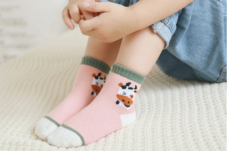 Kids' cartoon stockings with jacquard designs in various colors and patterns