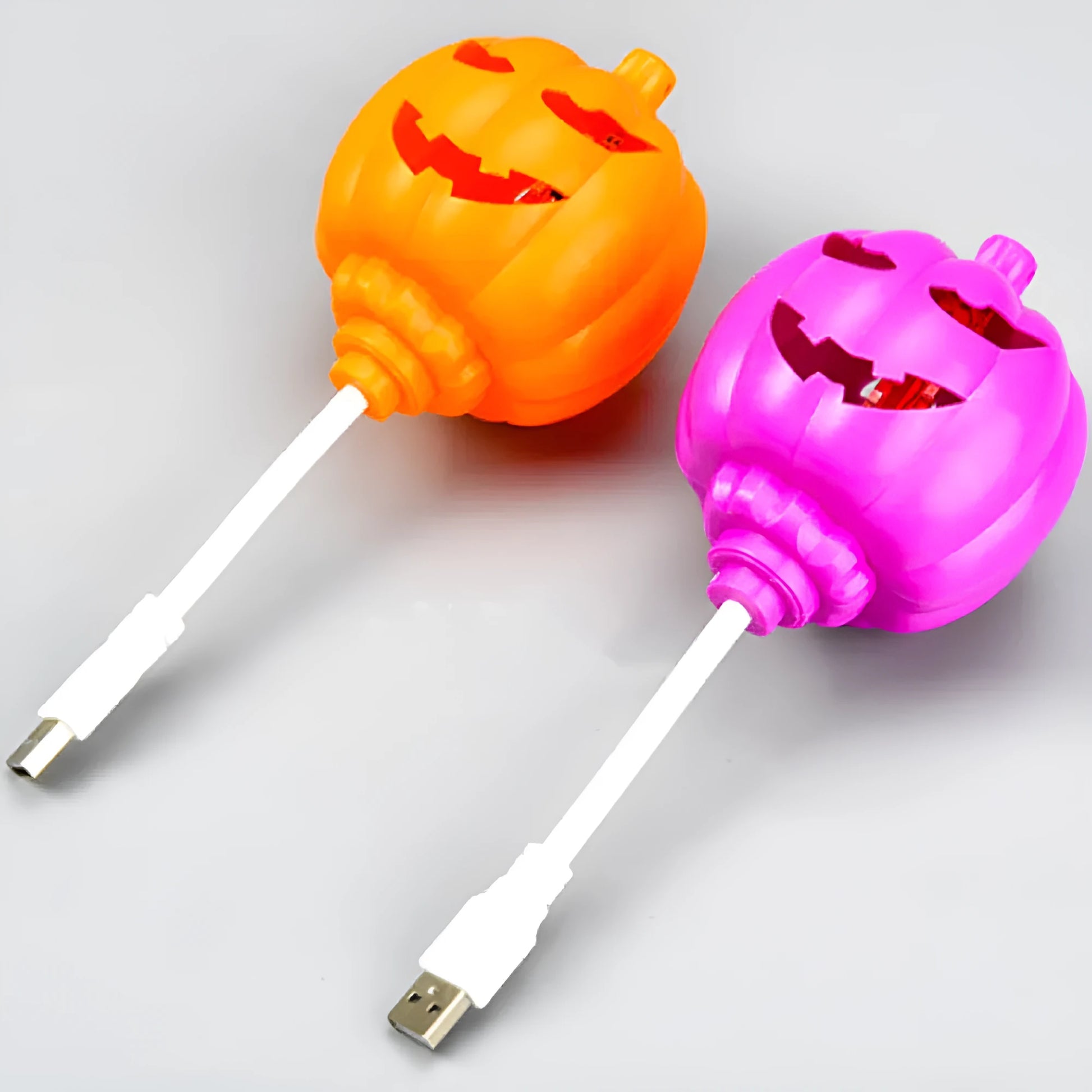 Plastic pumpkin decorative lamp with USB cable, available in purple or yellow light, measuring 22cm tall