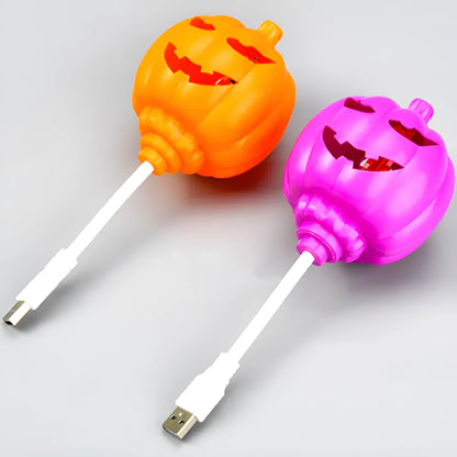 Plastic pumpkin decorative lamp with USB cable, available in purple or yellow light, measuring 22cm tall