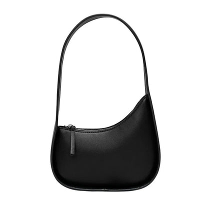 Structured caramel half-moon leather women's shoulder bag with a wide adjustable strap and zip closure.