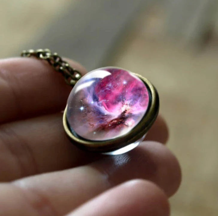 Mesmerizing double-sided galaxy pendant necklace in various celestial patterns and colors