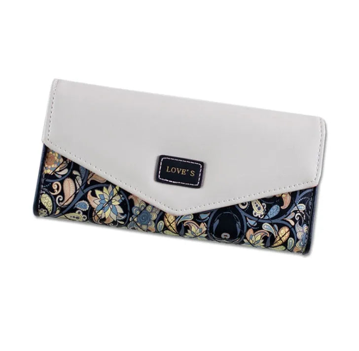 Three-fold leather wallet with buckle closure showing black colour variant, note clip visible inside compartment