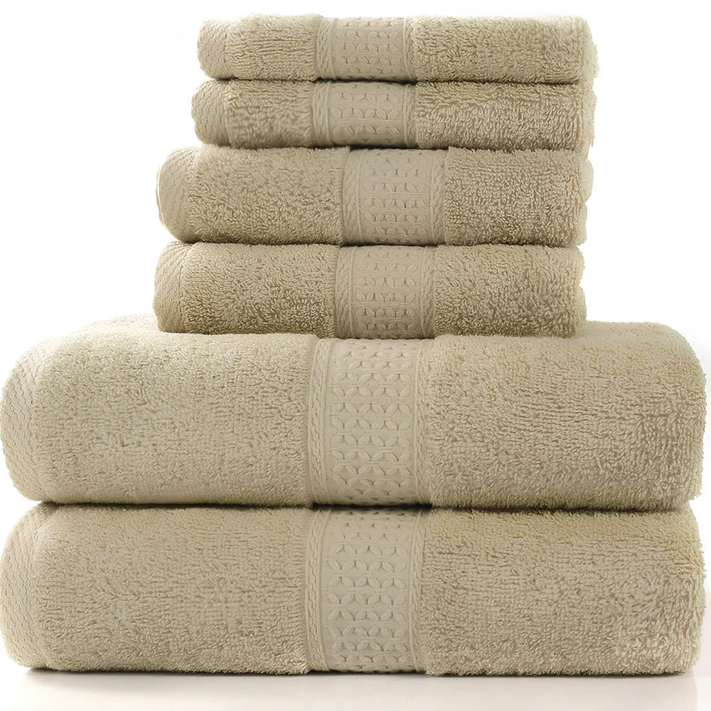 Cotton towel set showing bath towel, hand towel, and face cloth in coordinated sizes