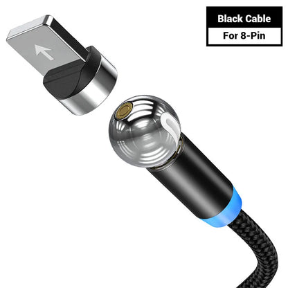 Black spherical magnetic charging cable with rotating head next to iPhone and Android phones