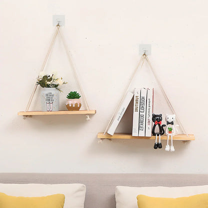 Natural wood wall-mounted shelf displaying small plants and framed photos with 1.3m hanging cord