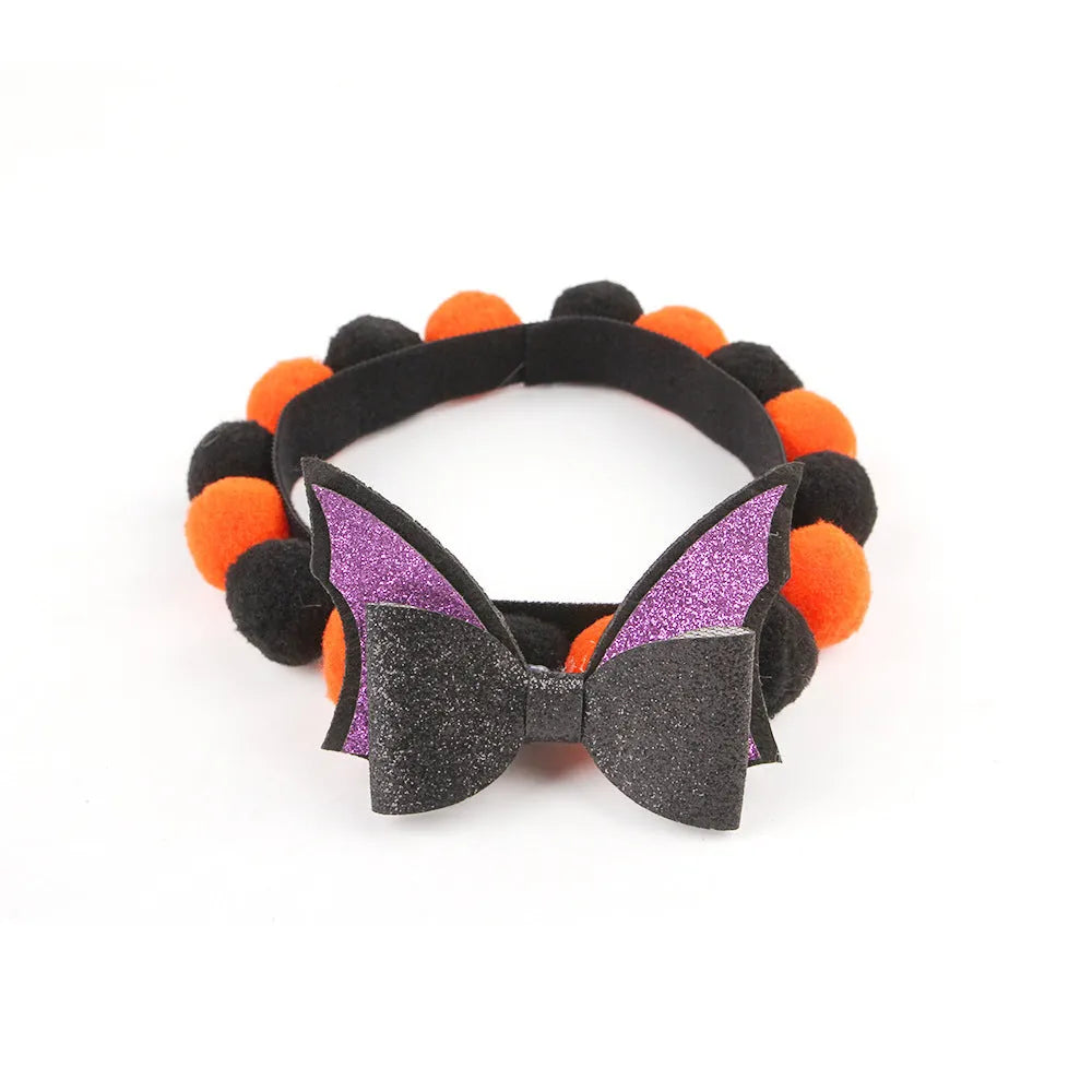 Halloween fur ball pet collar with pumpkin, pirate, witch and skull designs in six colour options